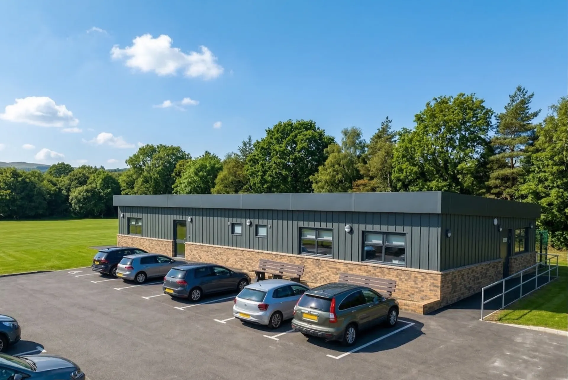 Grey Modular Office Building with Brick Skin Cladding in Car Park by MPH Building Systems