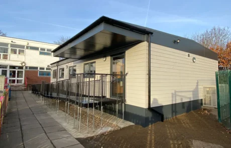 St Marks School Wraparound Care Modular Building with Accessibility Wrap, Sand Cladding and Entrance Porch Overhang