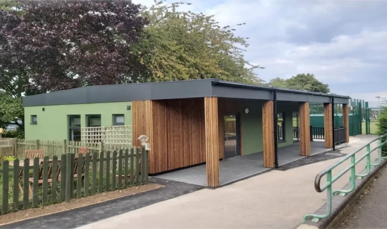 Modular School Building in Green Cladding and Timber