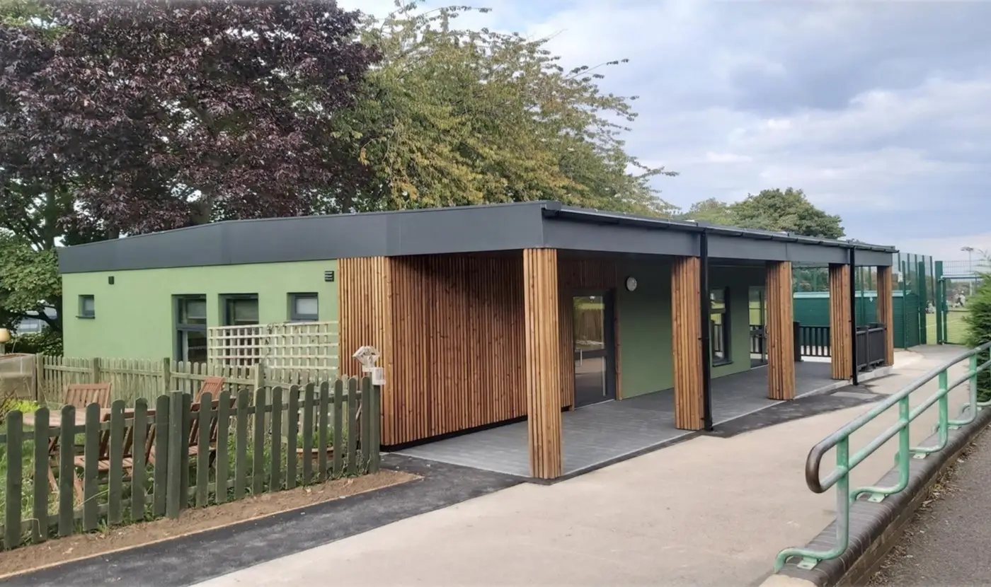 Modular School Building in Green Cladding and Timber