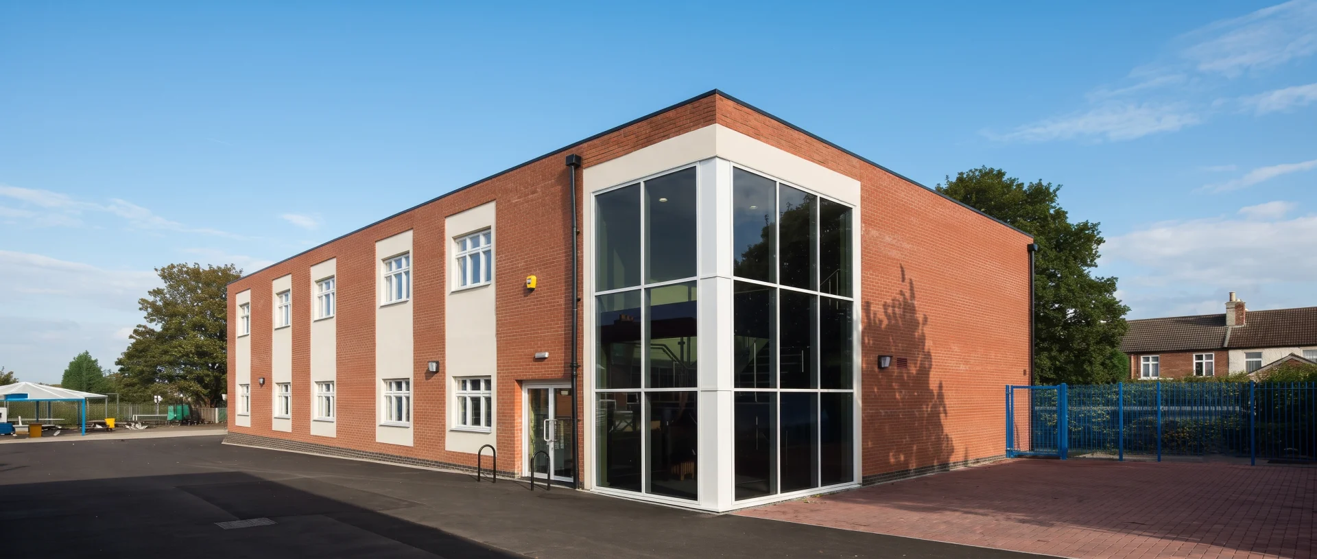 Contemporary 2-Storey Large Modular School Building with Brick Cladding and Feature Glass Atrium Corner Windows